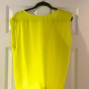 Sheer yellow blouse with open back